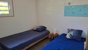 En eller flere senge i et værelse på Le Havre du Voyageur - le Balaou + 23 billeder