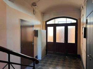 an empty hallway with a door and a window at Bright Cozy Apartment in Riga Quiet Center in Riga