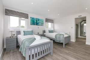 Ένα ή περισσότερα κρεβάτια σε δωμάτιο στο Maple Lodge