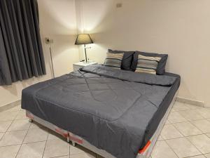 Ένα ή περισσότερα κρεβάτια σε δωμάτιο στο Leng Guest House