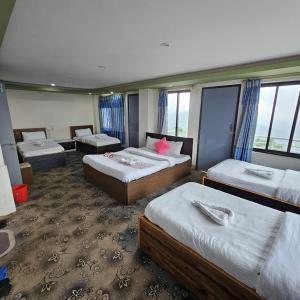 Voodi või voodid majutusasutuse Summit Hotel Ilam toas