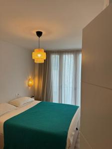 Katil atau katil-katil dalam bilik di CENTRIC HOUSE with PARKING