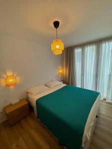 Katil atau katil-katil dalam bilik di CENTRIC HOUSE with PARKING