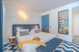 Posteľ alebo postele v izbe v ubytovaní Tuscany Hotel Alle Dune