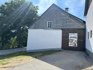 a garage with a large white garage door at Wandlhof Ferienwohnung 3971 Sankt Martin in Zeil