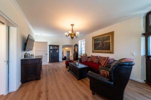 a living room with a couch and a table at Rehburger Landhaus in Rehburg-Loccum