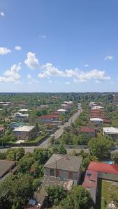 an overhead view of a town with buildings and trees at Apartment in Zugdidi