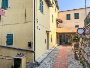 an alleyway between two buildings in a city at Apartment Ca du Maina by Interhome in Cipressa
