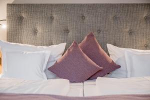 Postel nebo postele na pokoji v ubytování Ruhpoldinger Hof - Hotel & Wellness