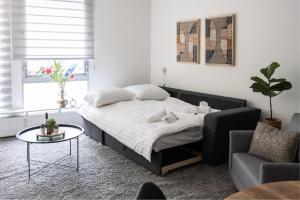 a bedroom with a bed and a table and a chair at 5p-home At Best Spot In Town Near Poppodium 013 in Tilburg