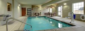 a large swimming pool in a hotel room at Cobblestone Hotel & Suites - Broken Bow in Broken Bow