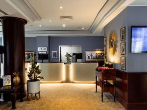 a lobby with a waiting room with a hair salon at Sofitel Luxembourg Europe in Luxembourg