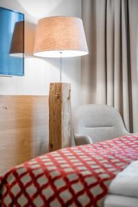 Postel nebo postele na pokoji v ubytování Ruhpoldinger Hof - Hotel & Wellness