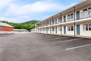 an empty parking lot in front of a building at Quality Inn & Suites Gorham Riverside in Gorham