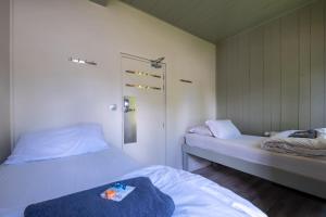 a bedroom with two beds at Vert Lodge Chamonix in Chamonix-Mont-Blanc