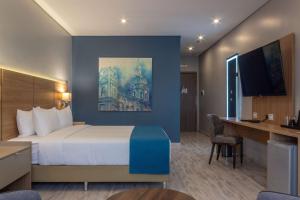 Un ou plusieurs lits dans un hébergement de l'établissement Tryp by Wyndham Asuncion