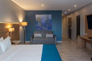 Un ou plusieurs lits dans un hébergement de l'établissement Tryp by Wyndham Asuncion