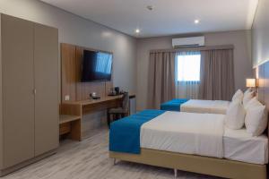 Télévision ou salle de divertissement dans l'établissement Tryp by Wyndham Asuncion