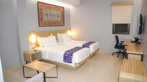 Ein Bett oder Betten in einem Zimmer der Unterkunft Best Western Sagita Hotel Jayapura