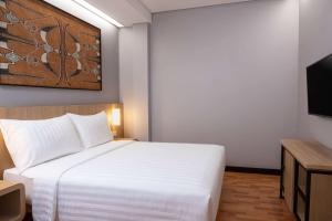 Ein Bett oder Betten in einem Zimmer der Unterkunft Best Western Sagita Hotel Jayapura