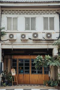 a building with two air conditioners on top of it at Dé Cafe & Rest House in Ipoh