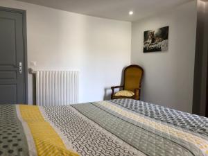 Voodi või voodid majutusasutuse Gîte Sidney toas