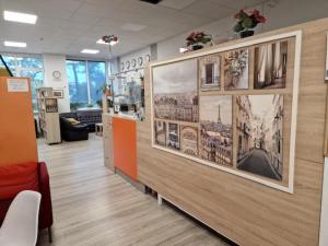 a room with pictures on the wall of a building at Capsule Hostel Logistic Vilnius in Vilnius +16 photos