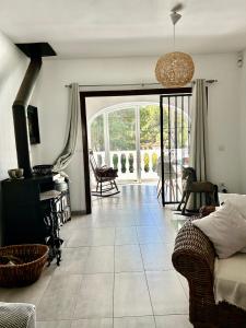 a living room with a couch and a fireplace at Tranquil setting in Moraira