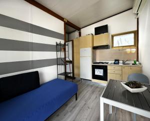 Kuchyň nebo kuchyňský kout v ubytování Villaggio Turistico dei Tigli