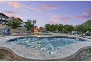 a large swimming pool in the middle of a resort at Table Rock Lake Luxury Resort Lodge - Boat Slip in Branson