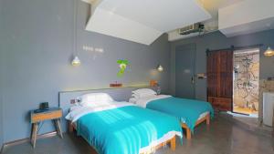 Postel nebo postele na pokoji v ubytování Dao Bian Inn + 37 fotografií