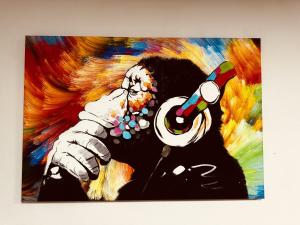 a painting of a person talking on a phone at Sterling House in Hounslow