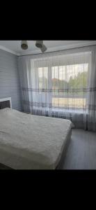 Postel nebo postele na pokoji v ubytování Уютный домик в Боровом + 21 fotografií