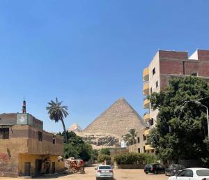 a view of the pyramids from a street at Big pyramid view in Cairo