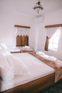 Postel nebo postele na pokoji v ubytování Guesthouse Gogu