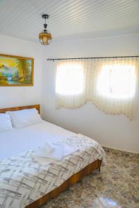Postel nebo postele na pokoji v ubytování Guesthouse Gogu
