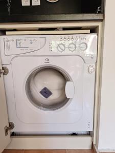 a white washer and dryer in a kitchen at Марина Кейп in Aheloy