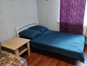 Posteľ alebo postele v izbe v ubytovaní Apartment Harkovskaya 1 floor