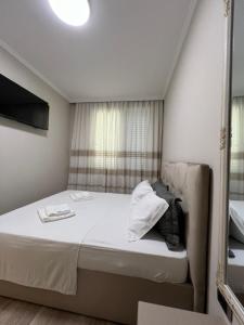 Postel nebo postele na pokoji v ubytování Center View Luxury Apartment