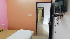 Et tv og/eller underholdning på Radha Spiritual Apartment