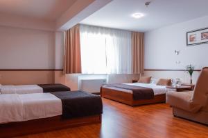 Letto o letti in una camera di Hotel Saraj