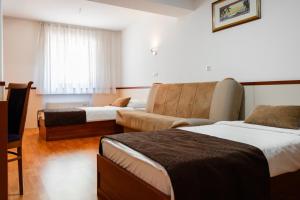 Letto o letti in una camera di Hotel Saraj