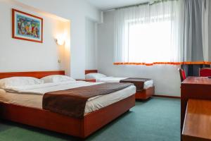 Letto o letti in una camera di Hotel Saraj