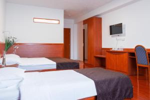 Letto o letti in una camera di Hotel Saraj