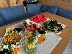 a table with a bunch of different types of fruit at Шале Рутенія - Chalet Rutenia apartments in Neporotovo