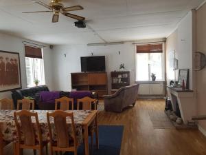 a living room with a couch and a table at Holmstagården in Bispgården