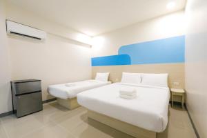 Postel nebo postele na pokoji v ubytování Hop Inn Hotel Davao