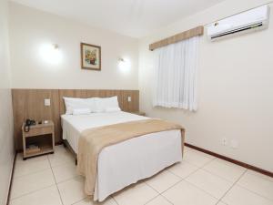 Cama ou camas em um quarto em Montblanc Hotel