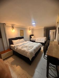 Postel nebo postele na pokoji v ubytování AWWA APART HOTEL