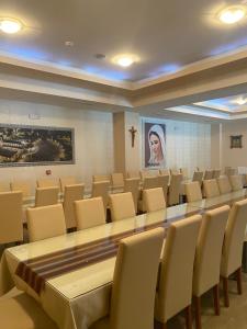a conference room with a long table and chairs at Hotel Dalija in Međugorje